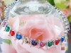 BRATARA DEOSEBITA MULTICOLORA DIN AUR ALB 18K SI TOPAZ